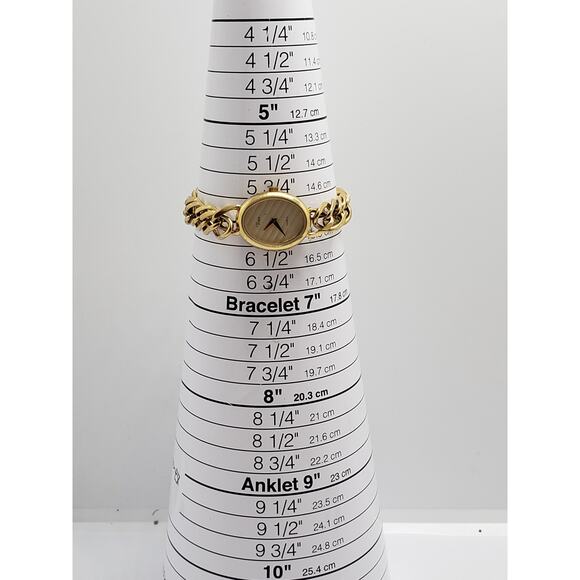 Women\'s Timex dress watch. Gold oval face with lined design. main image 4